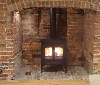 Charnwood Island 2 Cooker Top Stove -  with high legs in black installed by our stove fitters in Sutton, Surrey